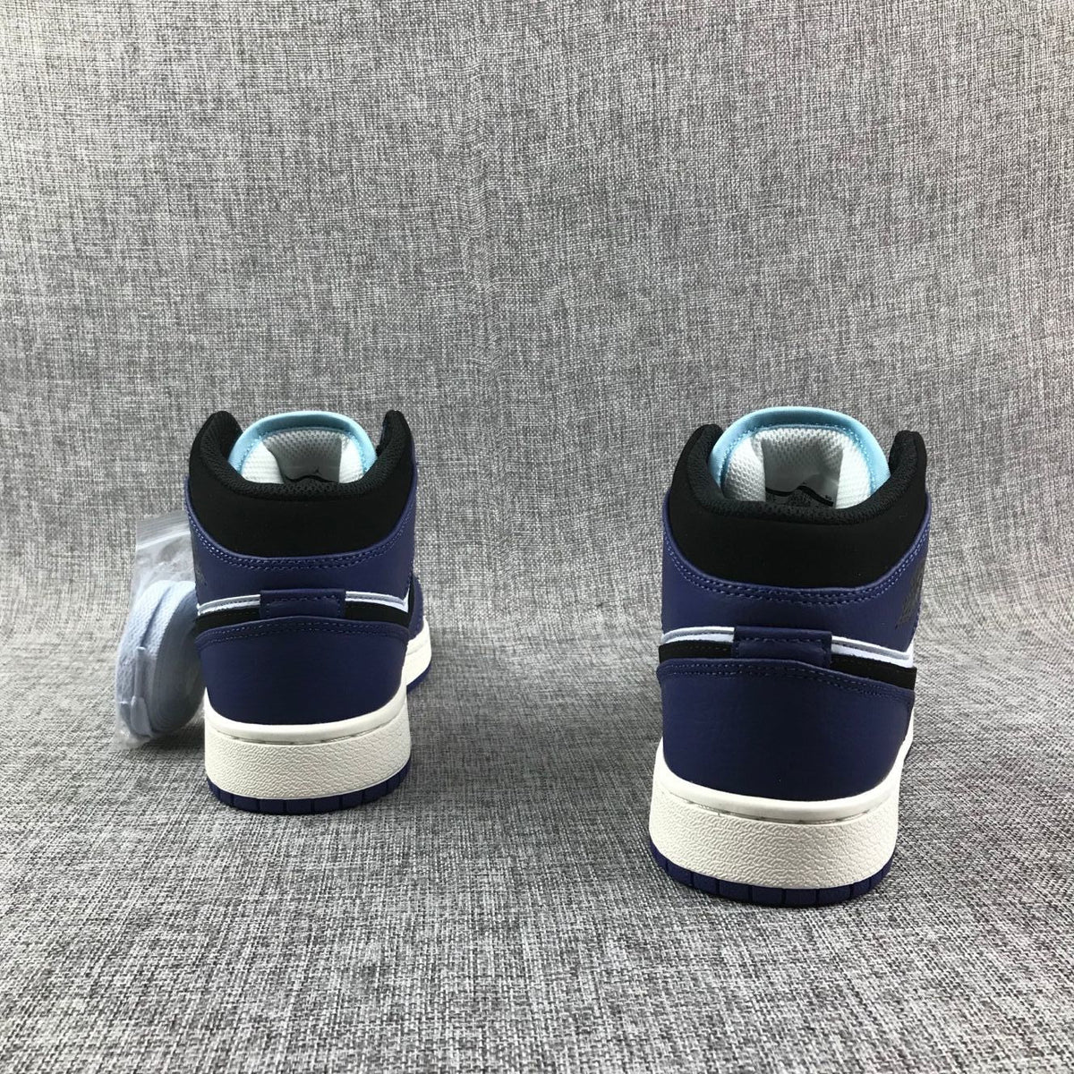 Air Jordan 1 Mid White, Black and Purple Sneakers