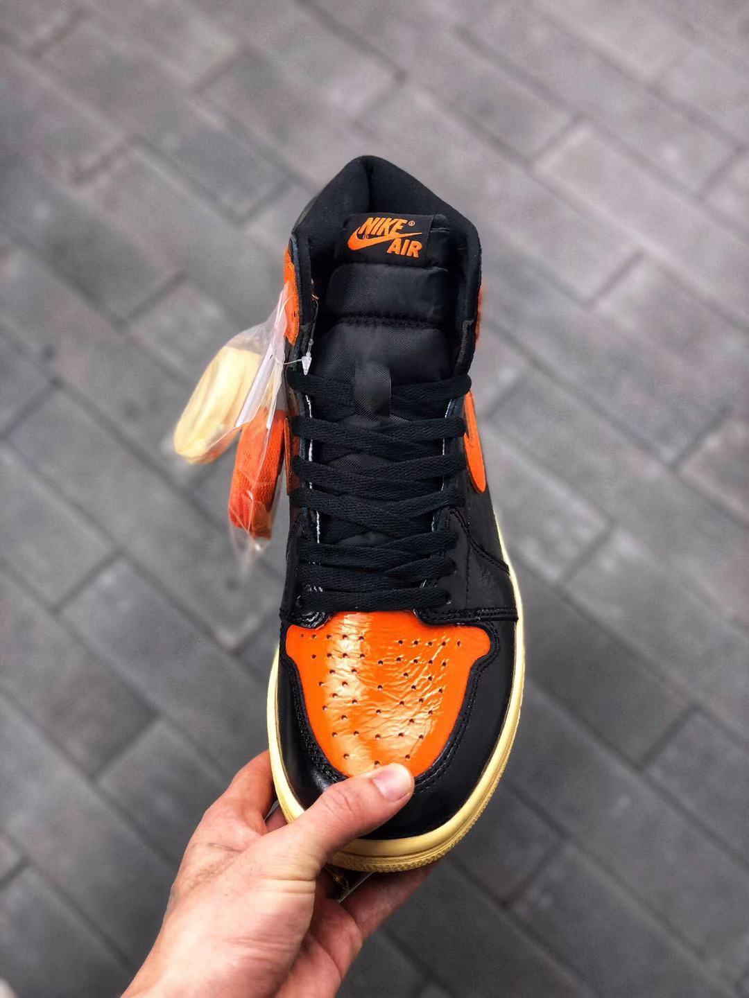 Air Jordan 1 Retro High OG Black and Orange Sneakers