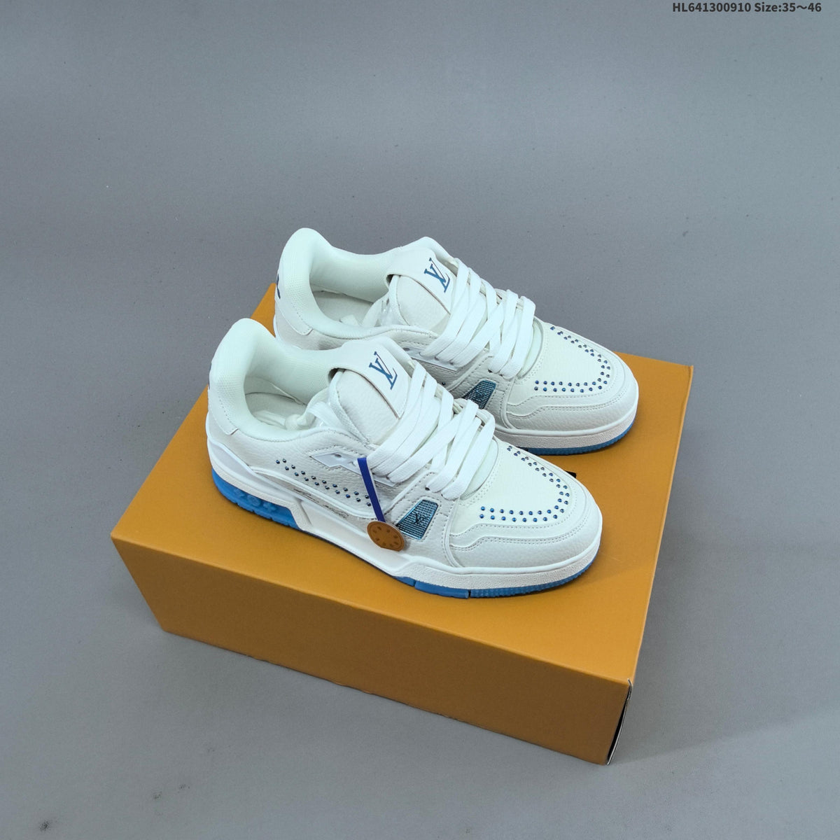 Louis Vuitton Studded Low-Top Sneakers in White and Black