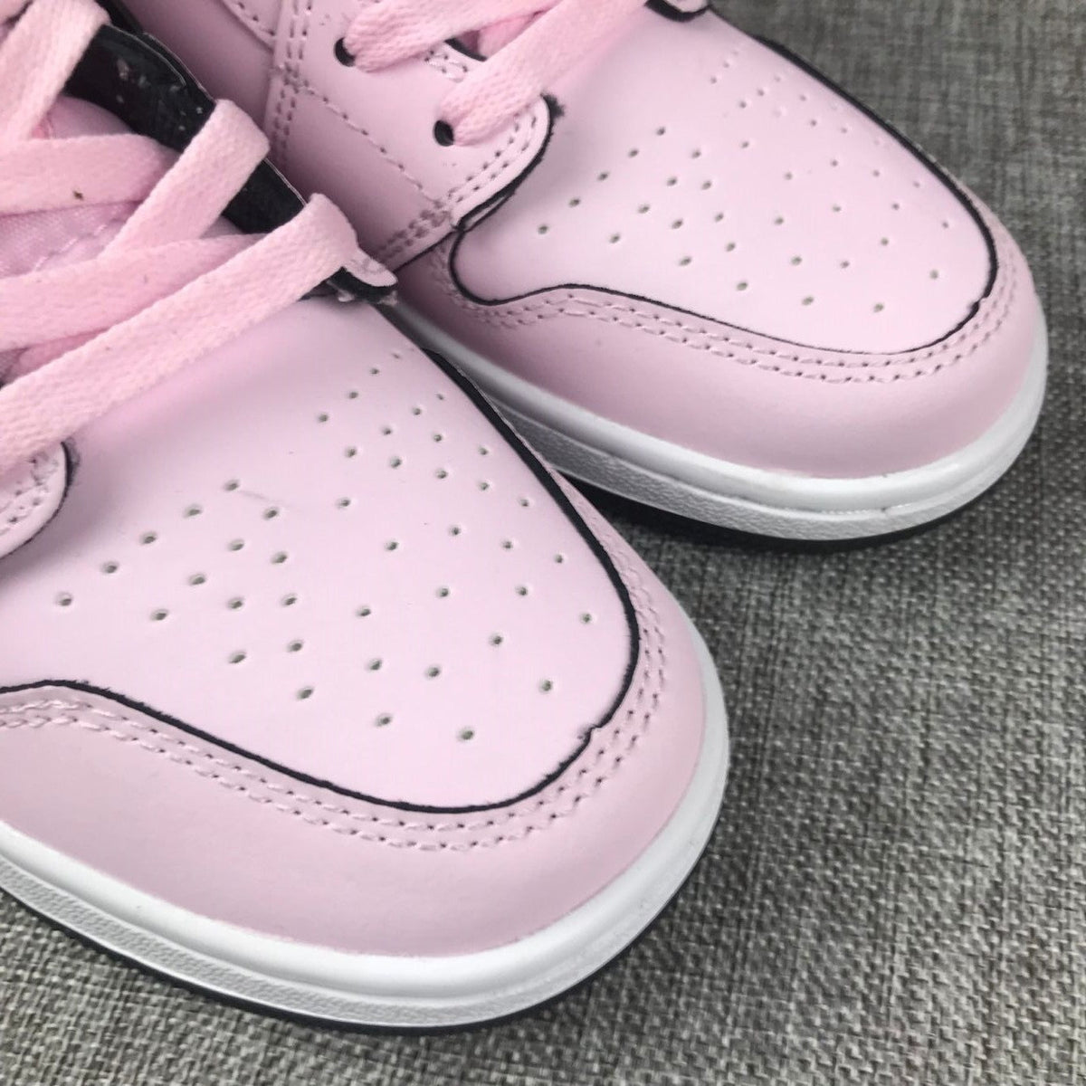 Air Jordan 1 Mid Pink and Black High-Top Sneakers