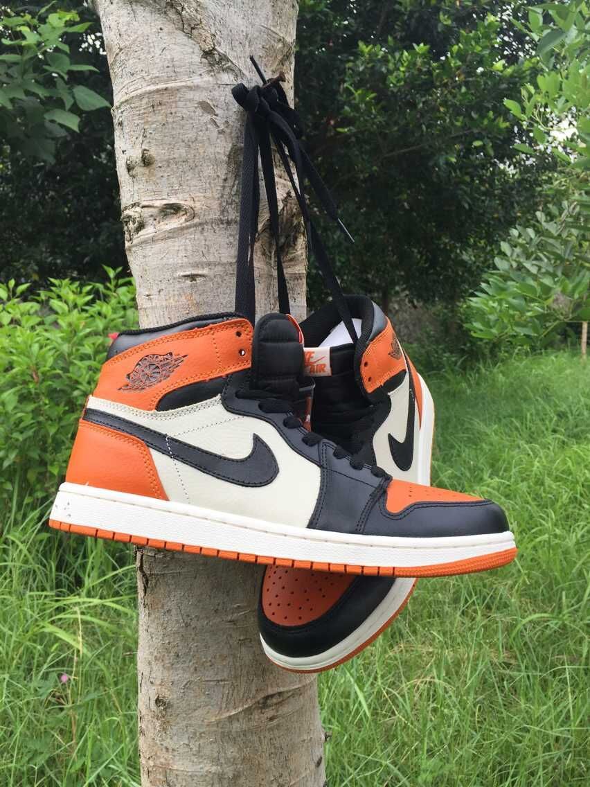 Jordan 1 High Sneakers in Black, White and Orange