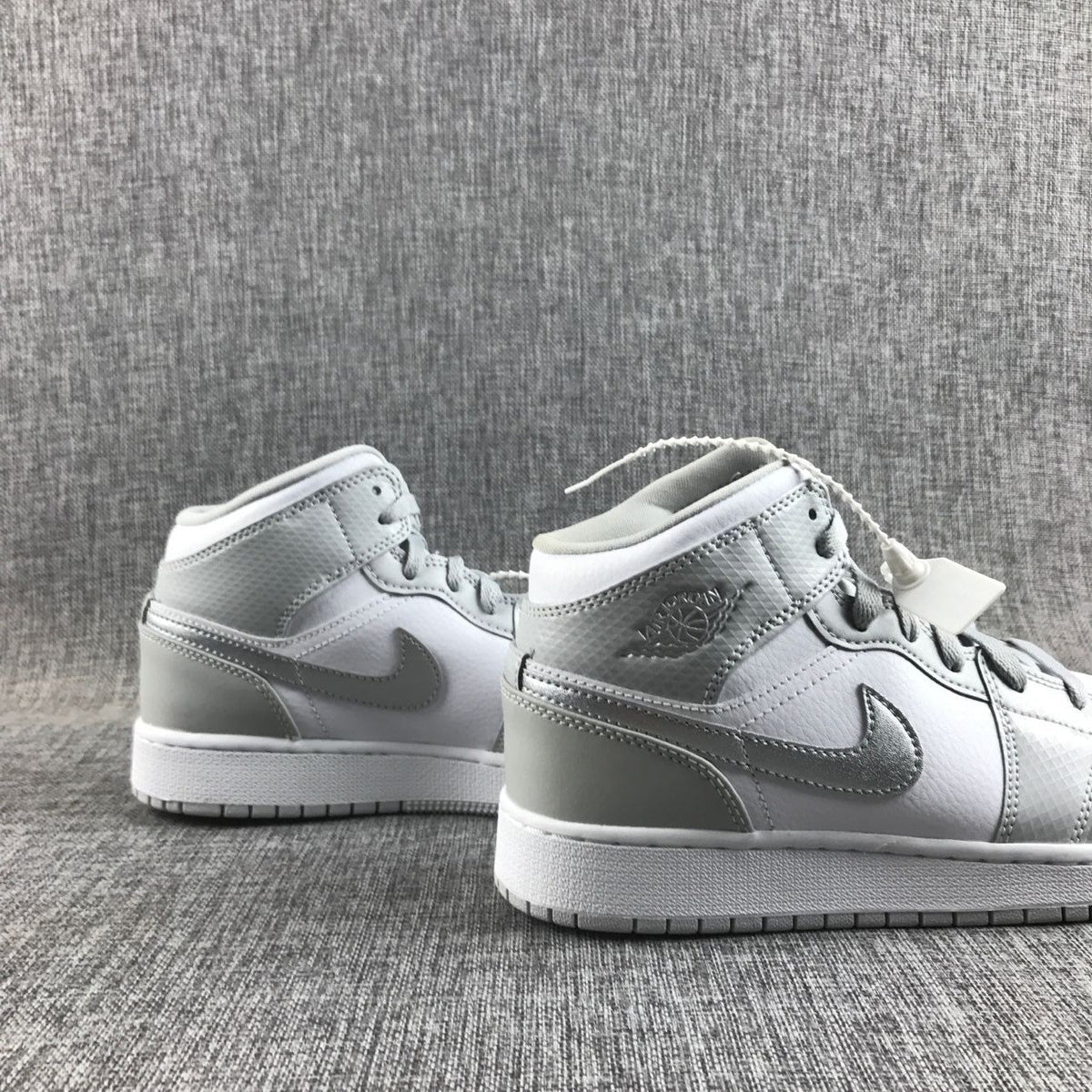 Jordan Air Jordan 1 Mid GS White and Silver Sneakers