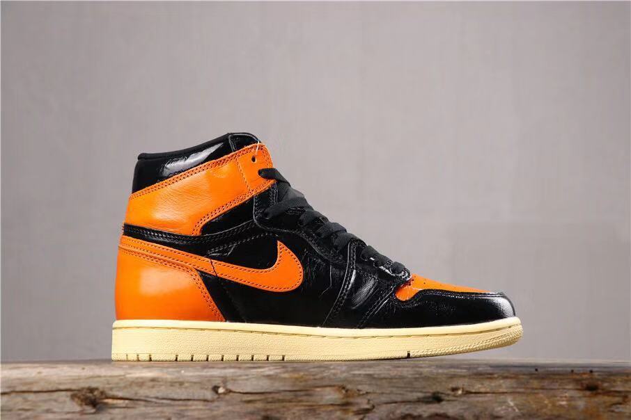 Air Jordan 1 Retro High OG Black and Orange Sneakers