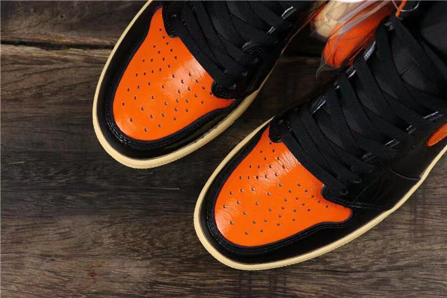 Air Jordan 1 Retro High OG Black and Orange Sneakers