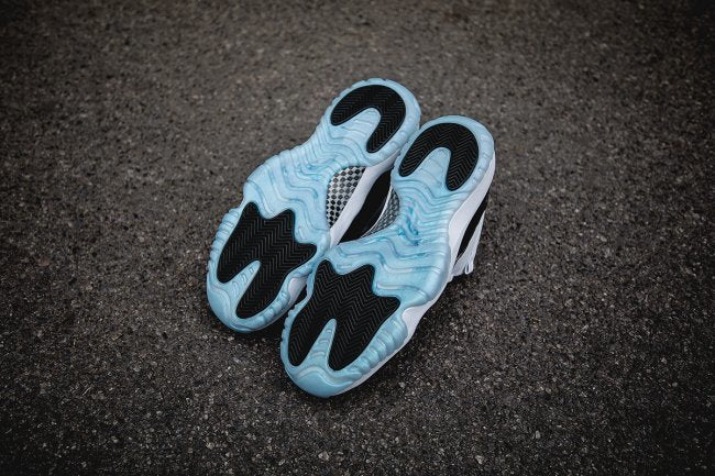 Air Jordan 11 Iridescent Sneakers in White and Black
