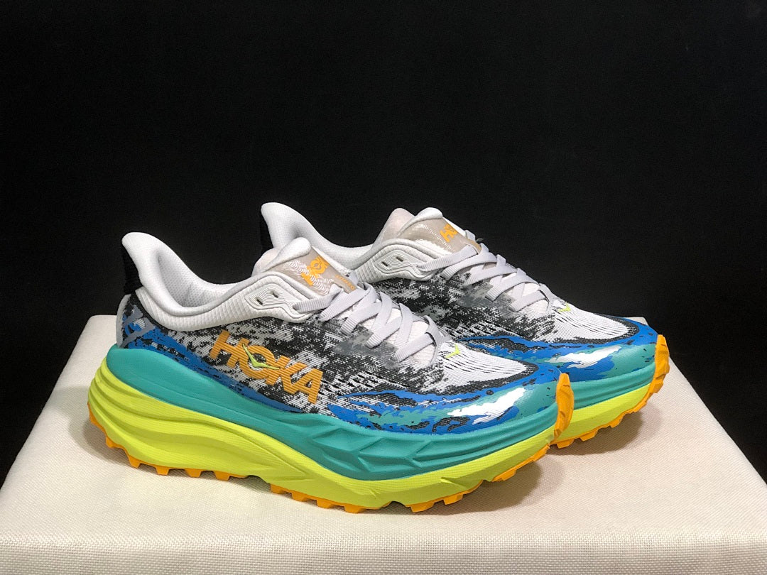 HOKA Stinson 7 Trail Sneakers in Blue and Lime