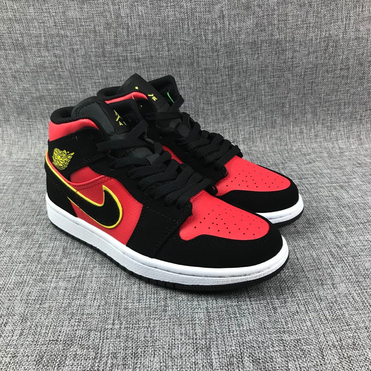 Air Jordan 1 Mid Black, Red and Volt Sneakers