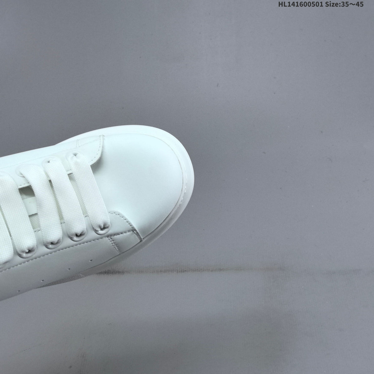 Alexander McQueen Oversized White Low-Top Sneakers with Black Heel