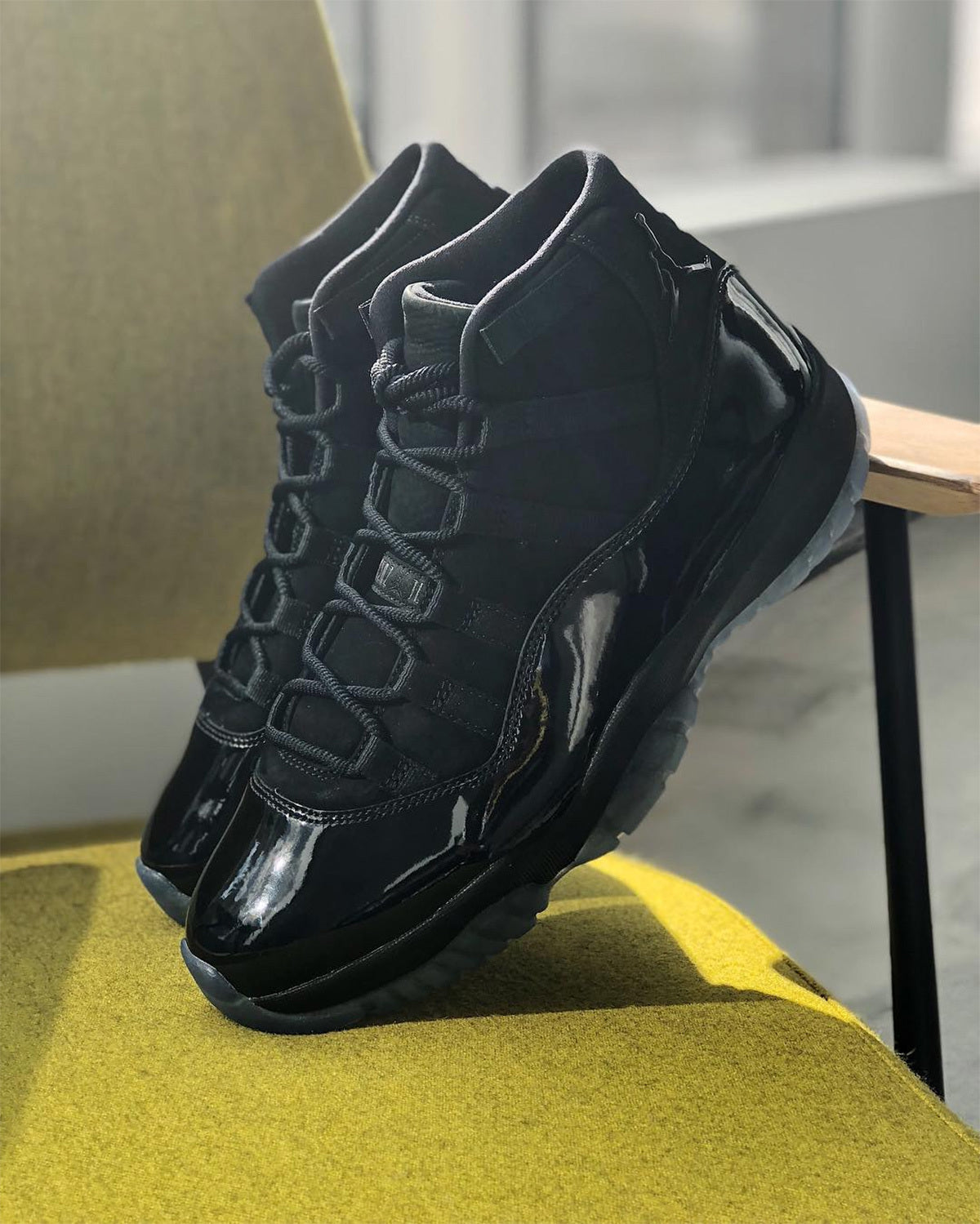 Air Jordan 11 Cap and Gown Black High-Top Sneakers