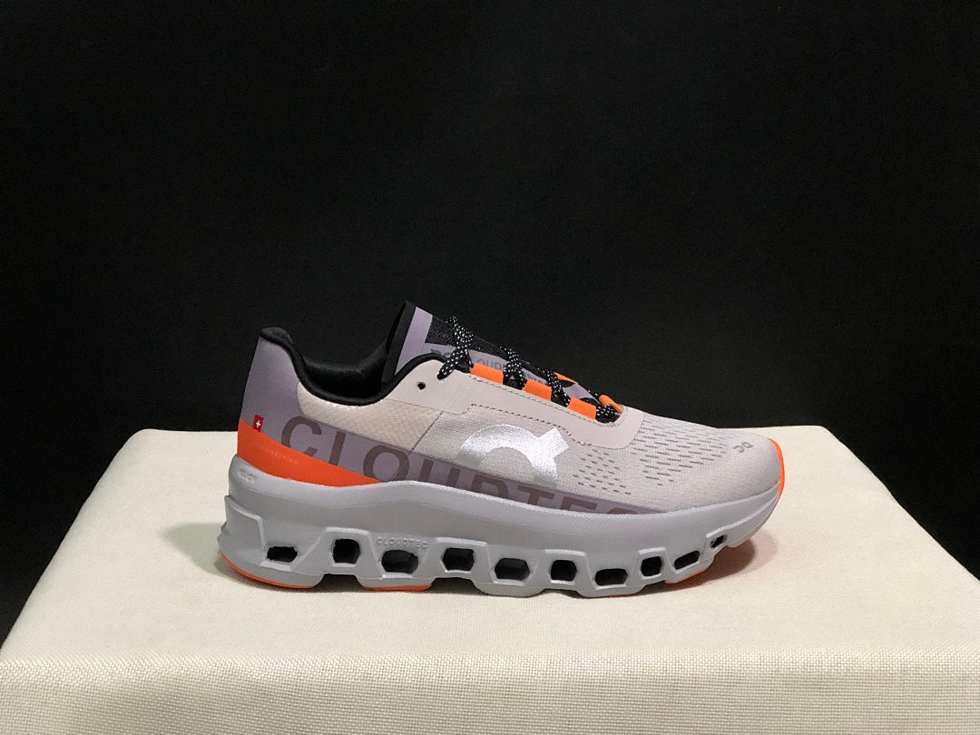 On Cloudmonster Sneakers in Foggy White and Orange
