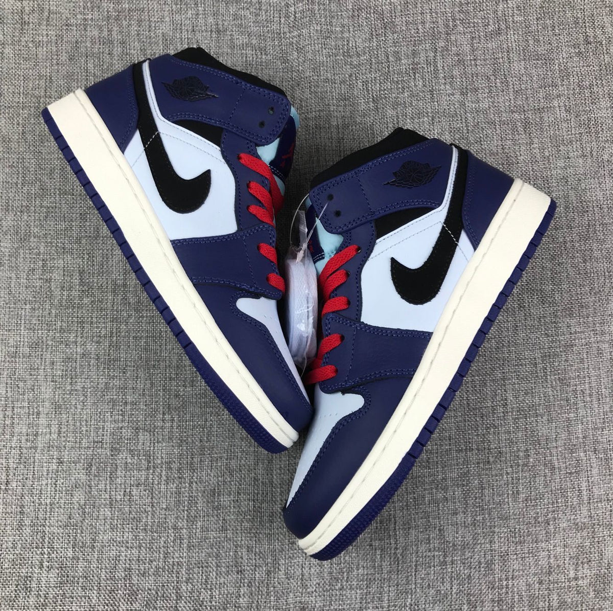Air Jordan 1 Mid White, Black and Purple Sneakers